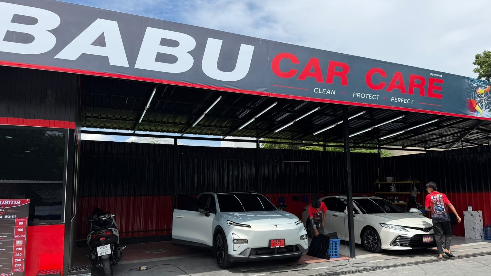 The BABU CAR CARE shopfront on Ram Inthra Soi 8, with cars being washed under the canopy